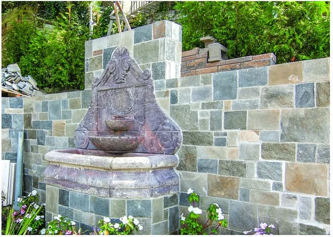 Alpine Grey Castle Stone on a garden fountain wall